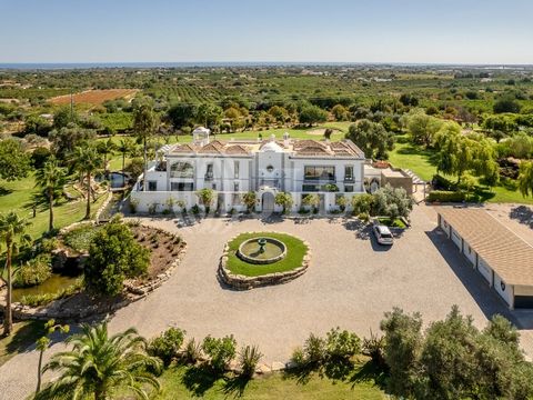 Estate with 90,000 sqm of land, 6-bedroom vila with 755 sqm of gross construction area, garden, swimming pool, and five parking spaces, in Santo Estevão, Algarve. Distributed over three floors, the house stands out for its spacious layout, grand desi...