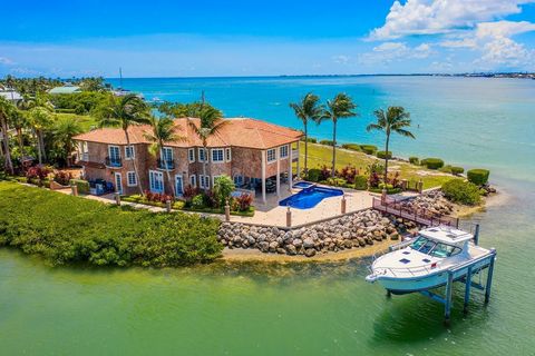 Over an acre on a private point in Key Colony Beach surrounded by water on 3 sides. Unparalleled location, relaxation and recreation-this house has it all. It doesn't get any better than this. A canal sits on one side with a dock for water toys. The ...