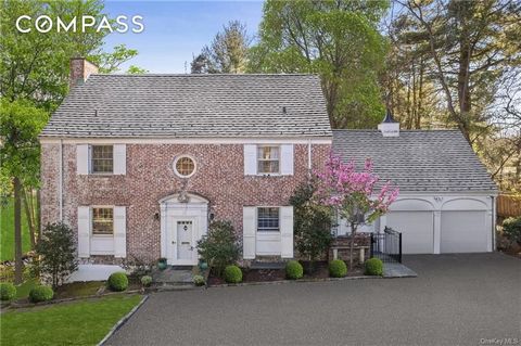 Discover timeless grandeur with modern sensibility & exceptional indoor-outdoor living in this much-admired Scarsdale colonial set on 0.38 acre of expansive, park-like land in an ideal Fox Meadow location just steps from train, shops, playground, sch...
