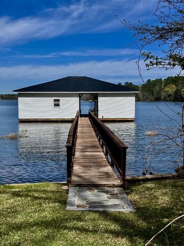 LAKE TYLER TEXAS, SUNSET LOVERS DREAM! This beautiful waterfront home faces West has a guesthouse, lake house, gated entrance, shop and extra storage building. The home is a 2-bedroom, 2 bathrooms on split level, newly painted kitchen cabinets, new p...