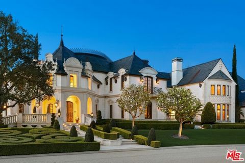 An architectural masterpiece of French influence and design, this stunning property offers unparalleled security, tranquility, and grandeur. Nestled within the exclusive enclave of The Estates of The Oaks, this residence is accessible solely through ...