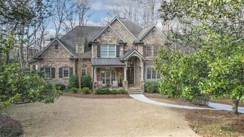 Nestled in the coveted Brittany neighborhood of Brookhaven, this exquisite custom residence boasts an impressive blend of brick and stone curb appeal, enhanced by a charming front porch. Step through the double front doors and beautiful windows, and ...