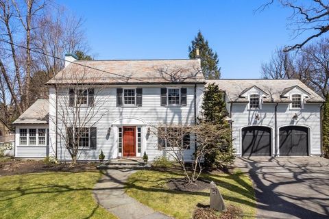 Set on a cul-de-sac in the wonderful village of Auburndale, this stunning residence has an exterior with curb appeal and an equally impressive interior. There is an oversized living room enhanced by a fireplace and a beamed ceiling, a den with a wind...