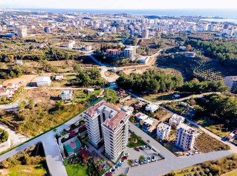 ALANYA/AVSALLAR 1.750 MT ZUM MEER. ABSTAND BLICK AUF DEN POOL, ECKWOHNUNG 1+1,59 m2 EINRICHTUNGEN INNENBEREICH AUSSENBEREICH – KINO – BEREICH FÜR HAUSTIERE – KAROOKE – GRILLECKE – SPIELZIMMER – GARTENPAVILLON – TAGUNGSRAUM – BOTANISCHER GARTEN – FLOW...