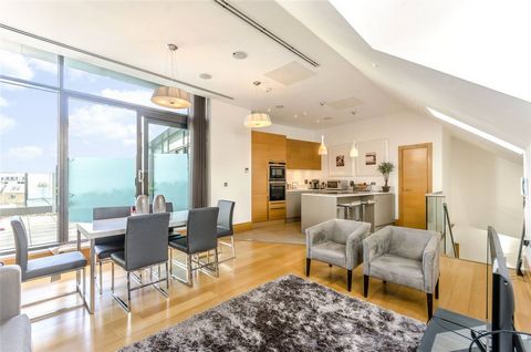 This stunning three-bedroom split-level penthouse boasts a private roof terrace with captivating city views. It's impeccably finished with high-spec features, including two bright reception rooms, a sleek kitchen with integrated appliances, and a mas...