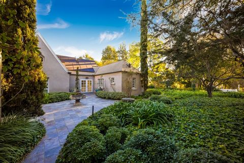 Nestled in six acres of lush, dreamlike forest, winding walkways, designed gardens, serene meditation zones, and dramatic water features that cascade into the canyons stands, Cromwell Gardens. A truly extraordinary estate, An Oasis Retreat in the hea...