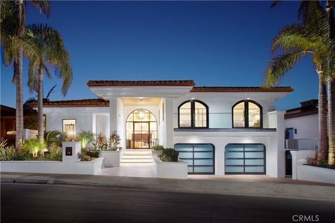 Welcoming breathtaking views of the Pacific Ocean, dramatic sunsets, and white water crashing over the iconic landmark of Monarch Point, this stunning custom home has recently been transformed into a virtually brand-new masterpiece in Dana Point's gu...