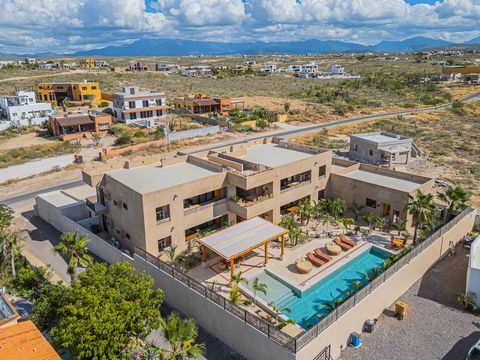 Indulge in the epitome of coastal luxury living with this turn key fully furnished 2 bed 2.5 bath condo in Todos Santos. Crafted with artisan made furniture the residence exudes sophistication and charm. The first floor access seamlessly connects ind...