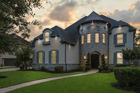 Stunning Darling 5 bed/5.2 bath/3 garage home located in an XL sized cul-de-sac in the sought after gated community of Avalon at Riverstone backing into a serene wooded reserve. A castle look elevation, this Stone and stucco home boasts TONS of upgra...