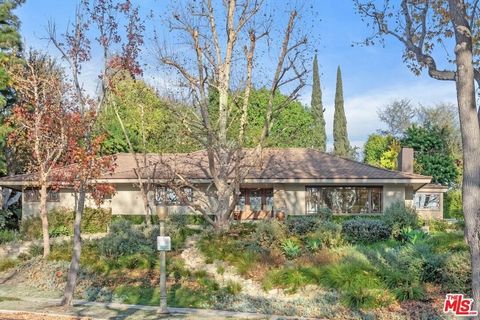 Nestled on a knoll above a tree-lined street in the heart of prestigious Little Holmby, this beautifully remodeled craftsman style single-story home blends timeless charm with modern updates. Perfect for entertaining, the expansive corner lot offers ...