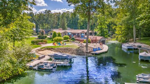 Enjoy effortless lakeside living at this Roaming Shores estate, designed for creating lasting memories and endless enjoyment. Set on four spacious lots, the property features a private pool, sandy beach, and boat house ideal for hosting gatherings or...