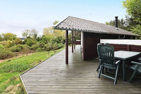 High located holiday cottage on a 3000 m² large plot with heather in 1st row to the Limfjorden. Panoramic views from both house and plot. Well-equipped kitchen with i.a. ceramic cooker and dish washer. 3 bedrooms and cot for the children. Large bathr...
