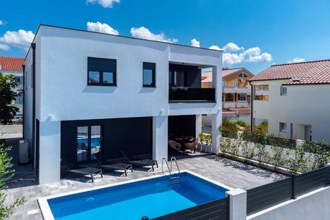 Location: Vrsi Sea: 200 m City center: 500 m Airport: 31 km Indoor space: 235 m2 Plot size: 350 m2 Bedrooms: 6 Bathrooms: 4 Terrace Swimming pool Air-conditioner Parking: 5 Pantry Features: - Air Conditioning - Dishwasher - Furnished - Internet - Ter...