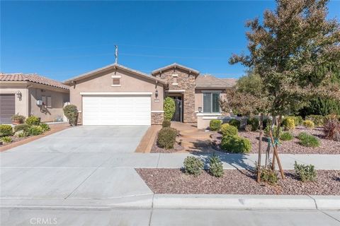 Welcome to Del Webb's Solera Diamond Valley Community, exclusively for 55 and over. Immerse yourself in the breathtaking panorama of the majestic mountains, which grace the horizon. This opulent cul-de-sac home comprises a great room, wine and coffee...