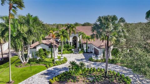 The epitome of luxury living awaits at this exquisite custom Arthur Rutenberg home, a true gem situated on nearly half an acre within the prestigious Lakewood Ranch Country Club. This estate spans nearly 7,000 square feet inside, boasting five oversi...
