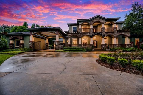 Welcome to this exquisite Craftsman style home in the coveted equestrian community of Stonelake Ranch, known for its sprawling acreage estates with private access to Lake Thonotosassa. This luxurious 4-bedroom, 5-bathroom estate spans an impressive 5...