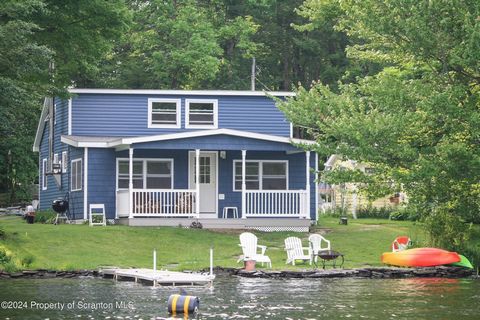 Escape to your own slice of paradise nestled on the shores of Fiddle Lake. This stunning lakefront property has been completely renovated to offer the perfect blend of modern comfort and timeless charm. With 3 bedrooms, a loft, and ample living space...