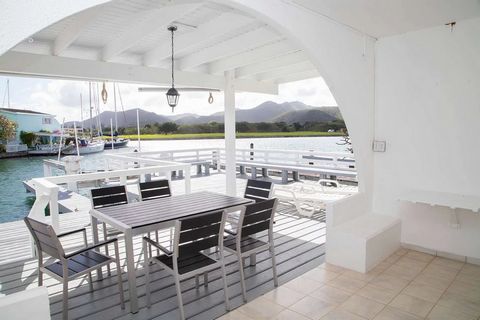 Located in Jolly Harbour. This villa is a two storey, two-bedroom waterfront property located on the north finger in the gated community of Jolly Harbour. The villa is rented fully furnished and air-conditioned. The ground floor is open plan with a f...