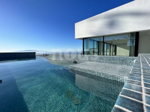 Reference: 04080. Discover this magnificent minimalist villa nestled on the prestigious golf course of the Ritz Carlton resort Abama, offering stunning views of the golf course and the south coast of Tenerife. With a privileged location in Abama, thi...