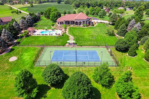 Welcome to Shetland Acres Estate - a 21-acre property with a stunning custom-built home is a testament to luxury and sophistication. Just 25 a minute drive outside of Indianapolis. As you arrive through the private entrance, a world of exclusivity un...