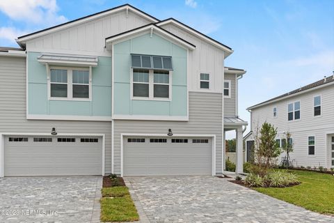 Be the first to experience the epitome of modern living in this stunning, brand-new end unit townhome nestled in the sought-after Pablo Cove neighborhood! With breathtaking pond views, an airy open concept design, and ample storage, every corner of t...