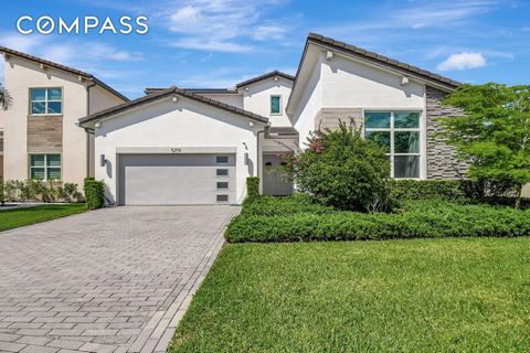 Welcome to 5209 Beland Drive, Lake Worth, Florida where elegance meets modern living. This stunning newer construction home, conveniently located close to the turnpike and all the latest amenities, truly checks all the boxes. Spanning 3,300 square fe...