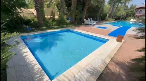 Luxury Apartment with Pool and Garden, Only 100 Meters from the Sea! Located in Fethiye, the pearl of Muğla, Yanıklar District, just 100 meters from the sea, this luxury apartment awaits its new owners with its unique location. Located in a tourism p...