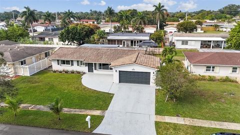 Beautifully renovated single-family home in the desirable Pasadena Lakes neighborhood of Pembroke Pines! This charming property features a stunning kitchen with a spacious breakfast bar and an oversized dining area, perfect for hosting and everyday l...