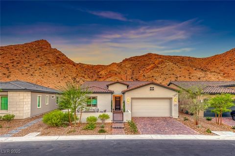 Why wait months for new construction? This desert oasis in the gated 55+ Del Webb community at Lake Las Vegas is ready now! This sought-after Garden Gate model offers 3 bedrooms, a den, and 2.5 baths with a spacious open floor plan. The gourmet kitch...