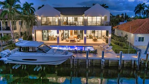 Coastal-Farmhouse Deepwater Estate sited on 90 +/- feet of waterfrontage in the prestigious enclave of Coral Ridge Isles. Masterfully crafted by renowned builder Zahn Development, this residence sets a new standard for living, with craftsmanship and ...