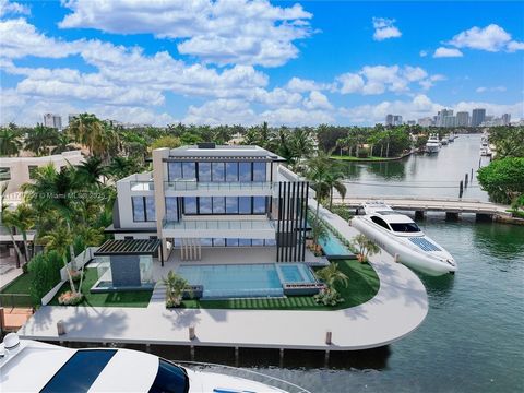 Set on a coveted point lot in the exclusive Harbor Beach enclave, this modern estate represents a premium tier of renowned luxury. The rare East Point location offers 250+/- ft of deep-water dockage for large yachts or multiple vessels, with commandi...