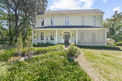 Motivated seller! National Register-listed1824 Federal house built for Revolutionary War soldier Colonel John Rutherford by architect Daniel Pratt. The original house was a two-over-two with two shed rooms and a two-story portico with columns, emblem...