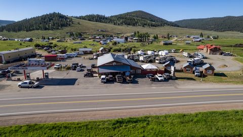 Welcome to Tomichi Creek Trading Post - an exceptional opportunity to acquire a meticulously managed, all encompassing Lodge. This remarkable turn-key lodge is tailor-made for avid outdoor enthusiasts seeking an authentic experience. Boasting a covet...