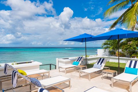 Located in St. James. This dazzling super luxury beachfront villa offers the same high-quality contemporary interiors as Mirador but includes a fifth bedroom. Nirvana’s top floor has been transformed into a unique sunset bar with plenty of seating, o...