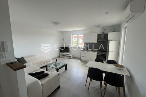 Modern two-bedroom apartment in Peroj, only a 4-minute drive from the sea. The apartment is located on the 1st floor and is situated in a perfect location close to restaurants, shops, beaches, and all necessary amenities for a comfortable life. The a...