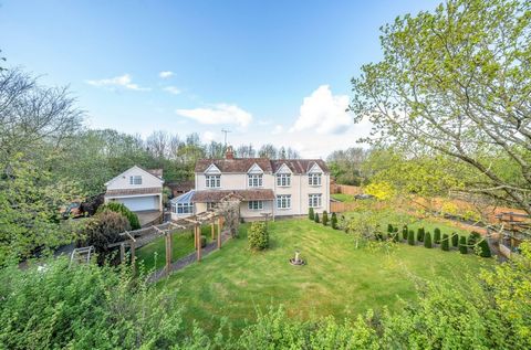 Sitting in grounds of 0.38 acre of private gardens this charming home has five bedrooms three bathrooms, plus variety of flexible reception rooms making it ideal for families and entertaining. In addition is a useful first floor studio/office (over t...
