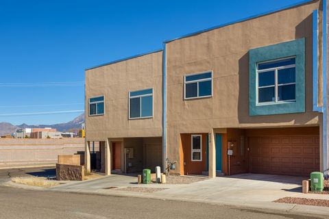 Stunning Custom Contemporary Townhome in the NE Heights with mountain views. Beautiful light and ambiance views, beautiful entrance with custom wood staircases, kitchen upstairs, refrigerated air, tankless water heater, 2x6 construction, with Quartz ...