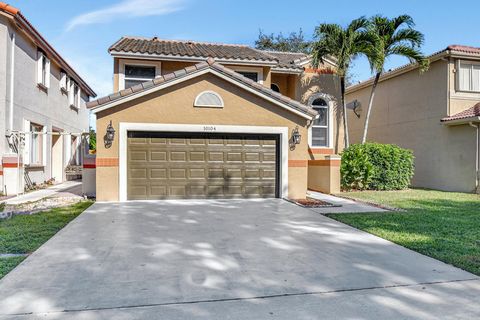 Welcome to your new dream home. Seller offering rent to own option. Start living the SE Florida lifestyle without any renovations. When you enter this home you are greeted by natural light and a vaulted ceiling entry way with a modern flair chandelie...