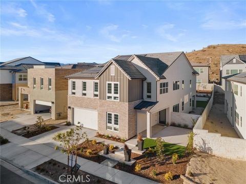 Step inside this breathtaking newer construction modern style home, built in 2023 and nestled on a quiet cul-de-sac in the highly coveted FivePoints at Valencia community. From the moment you enter the grand two-story foyer, you'll feel the thoughtfu...