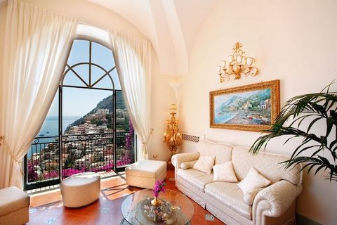 Price upon request Period home dating back to the 18th century, situated in Positano, with views over the charming town and the stunning bay. On 3 floors the villa comprises on the main floor a large living room with bright and panoramic windows faci...
