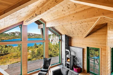 Spacious cabin with a great location and a beautiful view of the lake Rauarvatn and Sirdalsheiene. Large cabin with 8 beds; 4 bedrooms, 2 downstairs and 2 on the first floor. Cot available. Kitchen with microwave, freezer, dishwasher, and waffle iron...