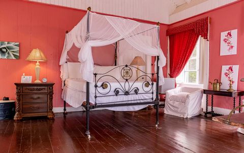 Located in Saint John's. The enchanting French Suite, decked out in regal red holds a wrought iron four-poster double bed dating back to 1800s with fine lace netting. This suite is situated in the historic Mercers Creek House, letting you step back i...
