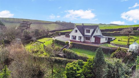 Nestled in the heart of one of North Devon's most coveted villages, Milltown, lies a remarkable 4/5 bedroom detached chalet style bungalow that boasts a commanding presence and stunning views across the village from its elevated position. This substa...