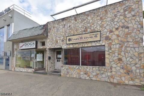 Here is you chance to own the excellent investment opportunity with potential for expansion! This property offers a prime location along the bustling Broadway/Rt 4 strip and includes two units. The current long standing tenant is a prominent dog groo...