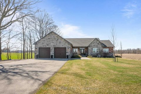 Stunning 4 Bdrms Bungalow In The Country. Main Level Open Concept Living With Floor-To-Ceiling Windows Overlooking At Farmland From Every Room. Lower Level Is Fully Finished With 2 Bdrms, Rec Room, Hobby Room. Oversized Garage With 11 Ft Ceiling Heig...