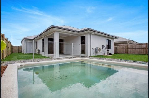Nestled within the prestigious Smithfield Village Estate, this superbly positioned family home on a 450m² land parcel offers the best of Cairns’ northern beaches. Imagine a convenient lifestyle surrounded by nature, parks, playgrounds, bike and walki...