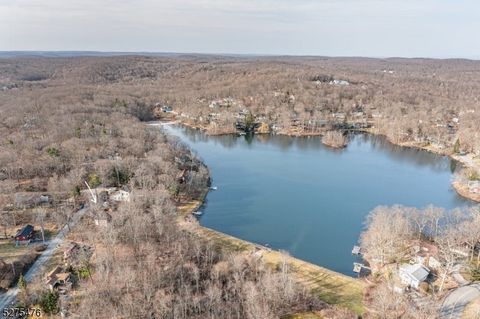 As close to lakefront as you can get without the lakefront price Charming property with stunning lake views, just steps away from the water's edge. Perfect opportunity to create your dream lakeside retreat and enhance this already picturesque setting...