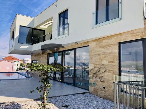 Super luxurious and exclusive villa on three floors in Okrug Donji, on elevated position, in seventh row to the sea. New construction, with 361 m2 of living space, outdoor heated pool of 32 m2 and a landscaped garden of about 450 m2. The partially su...