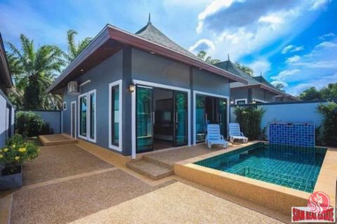 A cozy and private two bedroom, two bath pool villa is for sale in the Ao Nang area of Krabi. There is an open living plan with a sofa and wall mounted flat screen TV, dining table that seats four and a Thai-style kitchen. This room overlooks the pri...