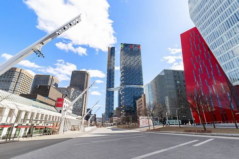 In a prestigious Montreal neighborhood, atop a brand-new building, sits a luxurious 3 1/2 condo, perched majestically on the 54th floor. This elegant space offers much more than just a panoramic view of the metropolis; it's a sophisticated refuge whe...